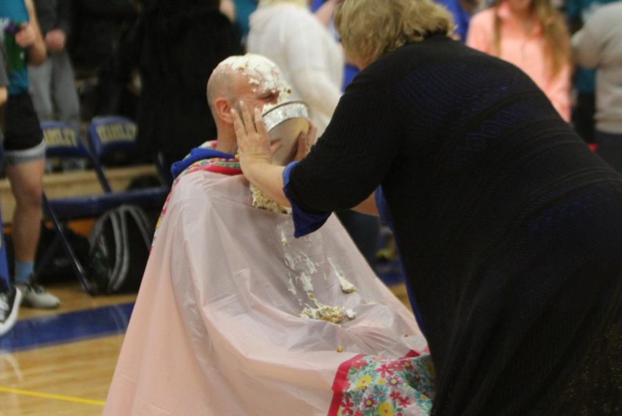 Social studies teacher, Mr. Robert Markwardt gets a pie in the face during the powdertuff championship for the Student Council penny fundraiser.