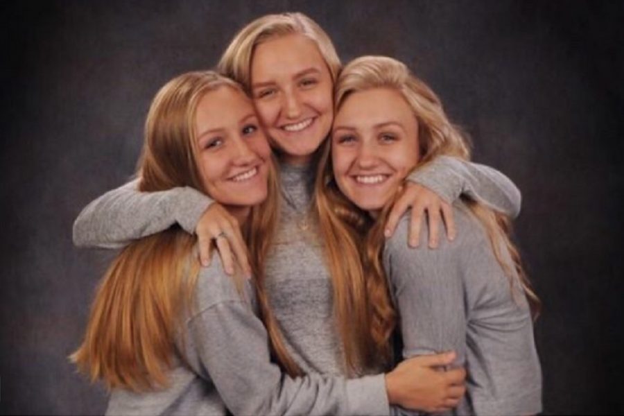 Amanda (left) poses with sisters Hannah (middle) and Kaitlyn VanOoteghem during their senior photo shoot.