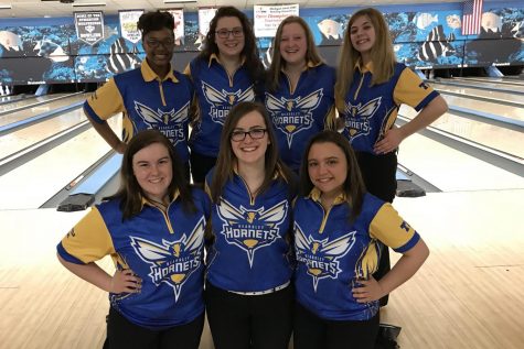 The girls bowling team enjoys having defended its ninth consecutive league title on Thursday, Feb. 15.