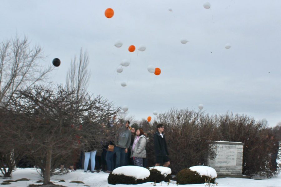 Balloons are released at Kearsley High Schools national school walkout Wednesday, March 14. The orange balloons represent the nationwide walkout, and the black balloons honor all victims of school violence in America.