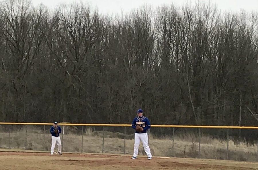 Freshman Kody Easton approaches the pitchers mound at the doubleheader Monday, March 26, against Carman-Ainsworth.