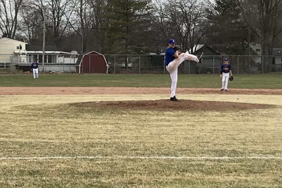Junior Dustin Bennett pitches for the Hornets during the first game.