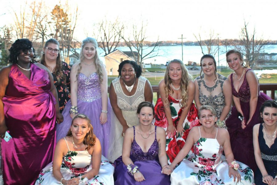 Ladies on the newspaper staff celebrate prom night together.