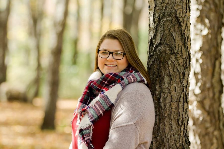 Recent graduate Bailee Stevens smiles brightly in a senior photo. Stevens is preparing to travel to Arizona for college.
