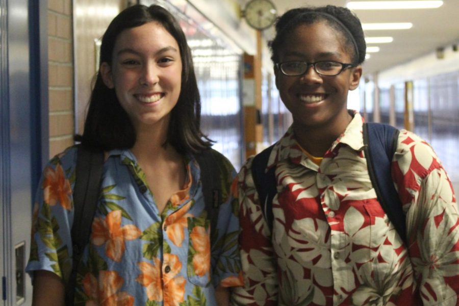 Juniors Ava Kelsey (l to r), and Asia Donald smile in their tropical attire.