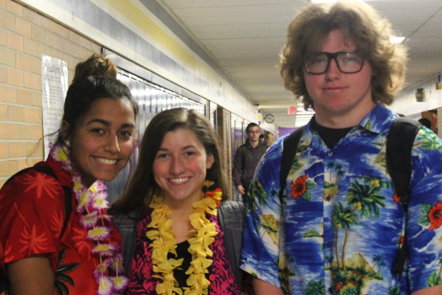 Seniors Mickeely Dias (l to r), Lindsay Flynn, and Josh Gunther show off their colorful Hawaiian shirts on Tropical Tuesday.