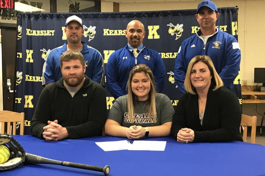 Senior Isabelle Easton (bottom, middle) signed a National Letter of Intent on Tuesday, Oct. 23, to play softball with Cleary University.