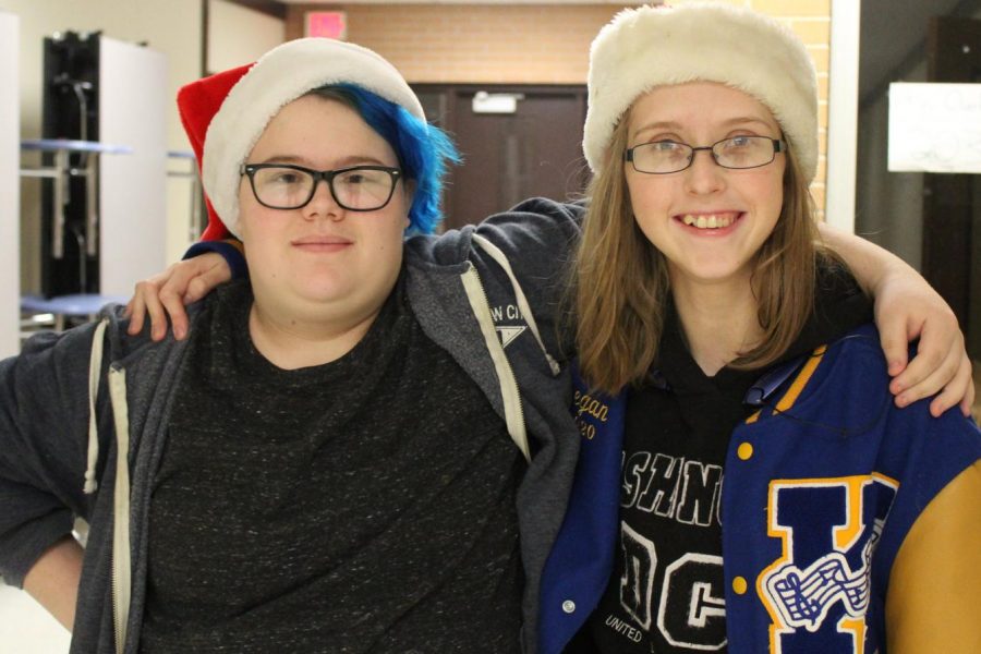 Junior Emily Edenburn (l to r) and Megan Little show off their holiday spirit for Christmas hat and sock day.