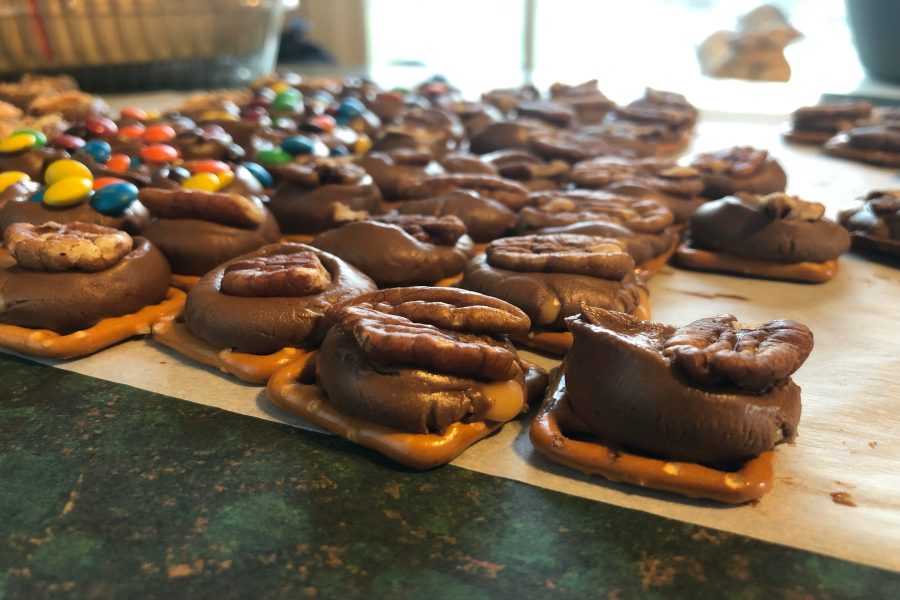 The finished product of turtles has a variety of toppings like M&Ms, crushed Butterfingers, and pecans.