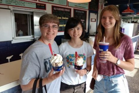 Mrs. Angela Hobson (l to r), senior Natsuho Kaneshiro, and senior Emelie Schuessler enjoy sweet treats. Hobson hosts the two exchange students.
