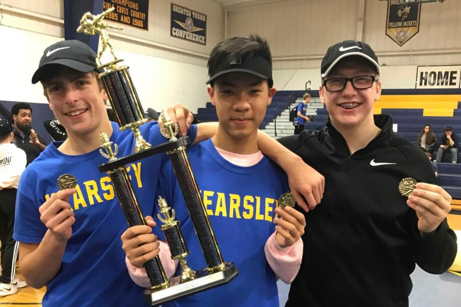 Junior+Trenton+DiGenova+%28l+to+r%29%2C+senior+Duy+Nguyen%2C+and+junior+Brandon+Fisher+stand+with+their+trophy+from+winning+the+Capac+tournament+in+wrestling.