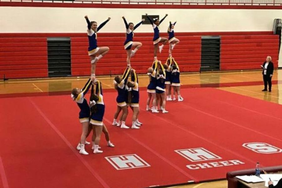 The cheer team performed one of its routines at a league competition Wednesday, Jan. 9, at Holly.