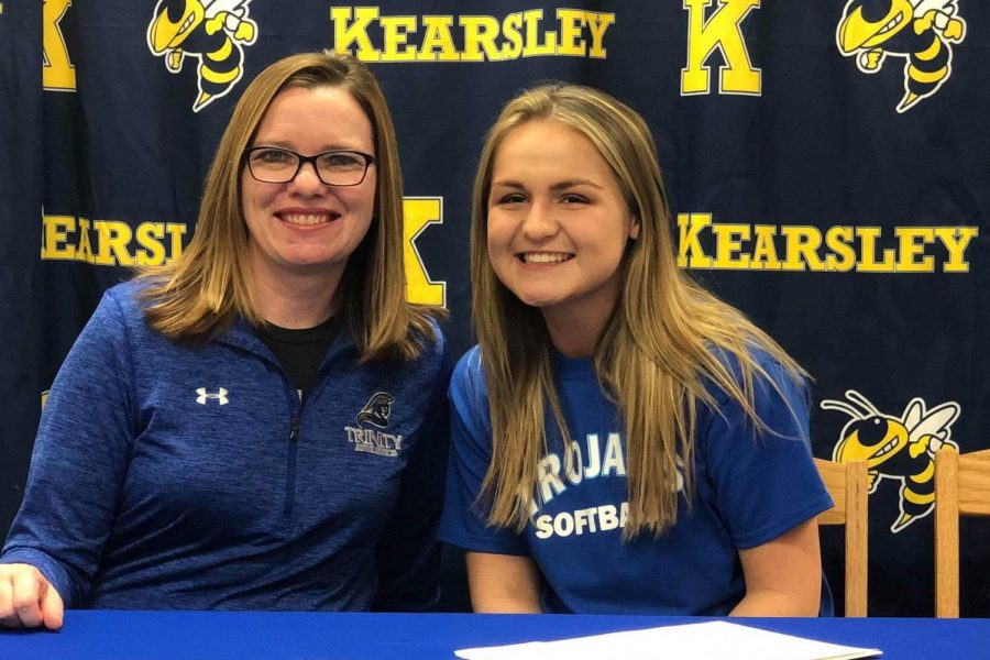 Senior Halle Parish (right) poses with Ms. Heather Logue, athletics director, on Wednesday, Feb. 27, as she signs with Trinity International University to play softball.