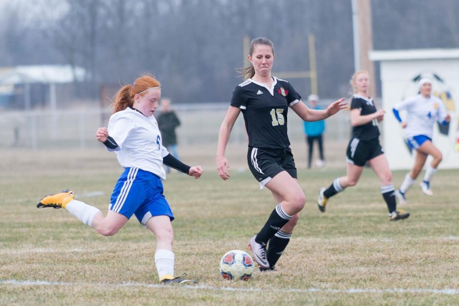 Sophomore Miranda Hardy (left) kicks the ball during a game of the 2018 season.