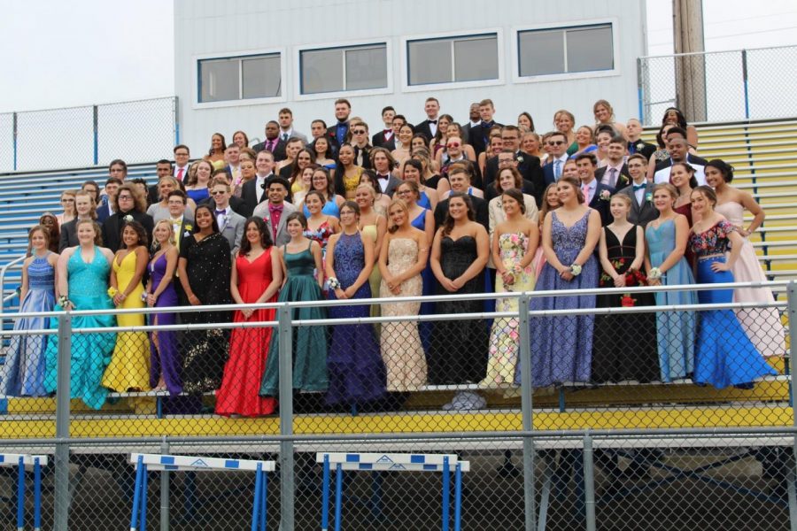 The Class of 2019 smiles for its prom photo.