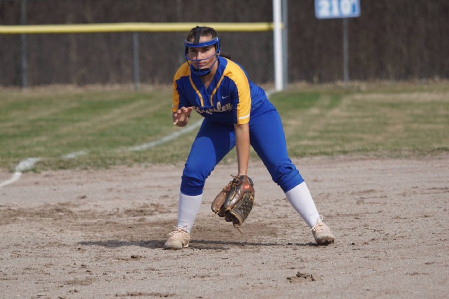 Senior+Jacee+Sword+plays+third+base+in+a+non-league+game+against+Powers+Catholic+on+Friday%2C+April+12.+The+softball+team+was+victorious+against+the+Chargers+in+both+games+of+a+doubleheader..