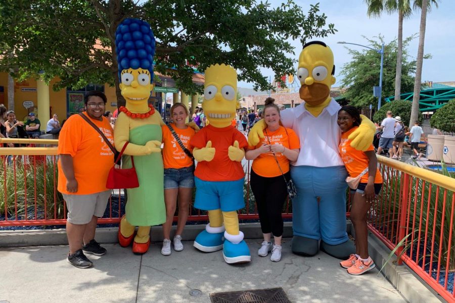 Seniors (left to right) Niccos Patrick, Chloe Clarambeau, Mary Wheeler, and Robrianna Weatherspoon pose with The Simpson characters during their trip to Orlando