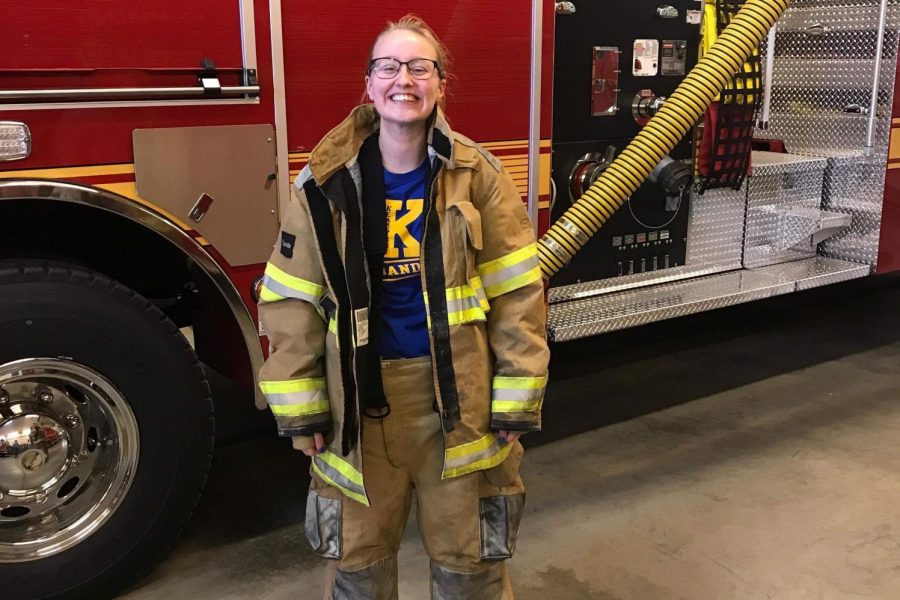 Senior Lindsey Bouchard dons her firefighting gear while at the Genesee Township Fire Departments Station 2..