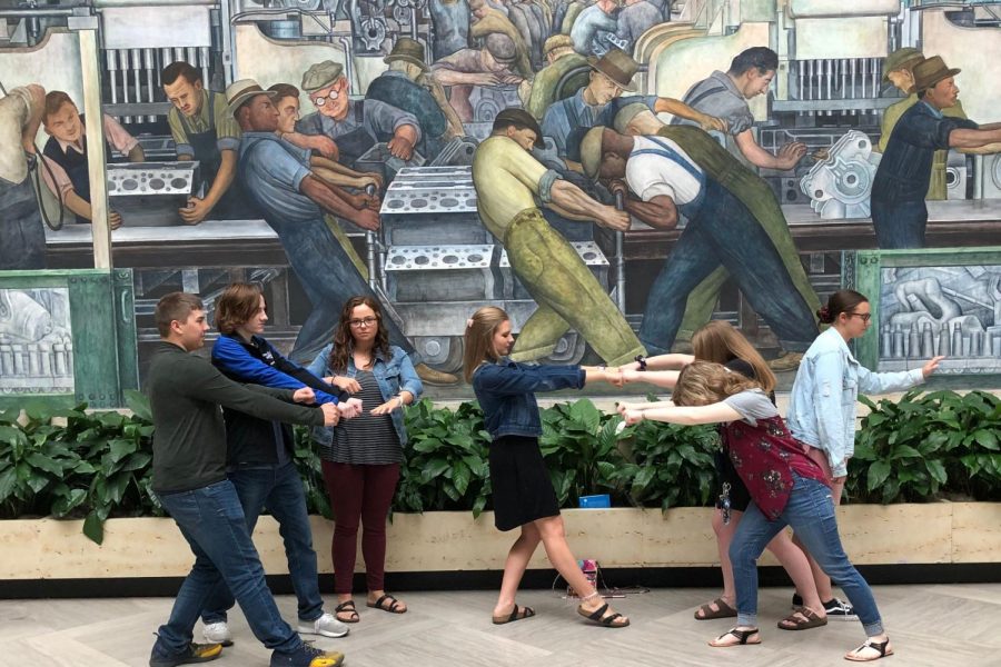 Foreign language students pose to copy a mural at the Detroit Institute of Arts on Wednesday, May 1.