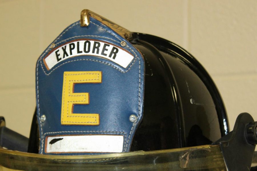 Young people who are explorers have a blue shield on the front of their firefighting helmets.