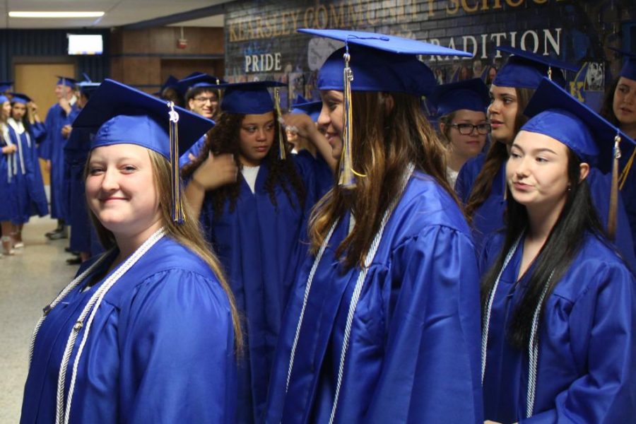 Members of the Class of 2019 await their entrance into the gymnasium for Class Day on Wednesday, May 29.