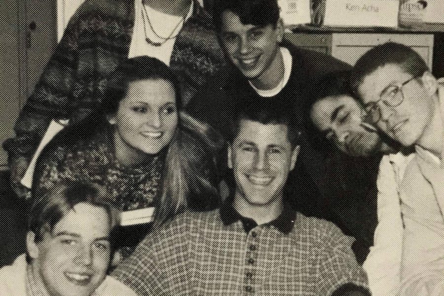 Mr. Darrick Puffer (center) smiles with students in 1998.
