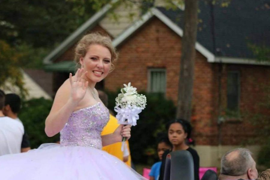 Junior Felicia Cunningham waves to the crowd during the 2019 Homecoming Parade. 
