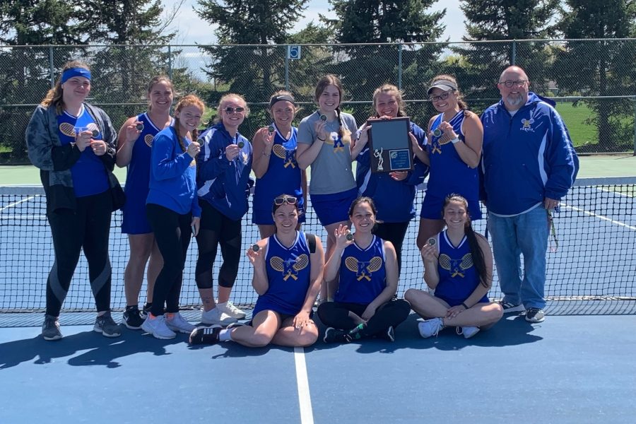 Girls+on+the+tennis+team+smile+with+their+trophy+after+finishing+first+at+the+Owosso+Quad+match+Saturday%2C+May+4.