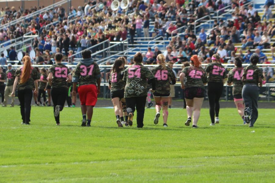 The Class of 2019 takes the field during the 2018 powder puff tournament.