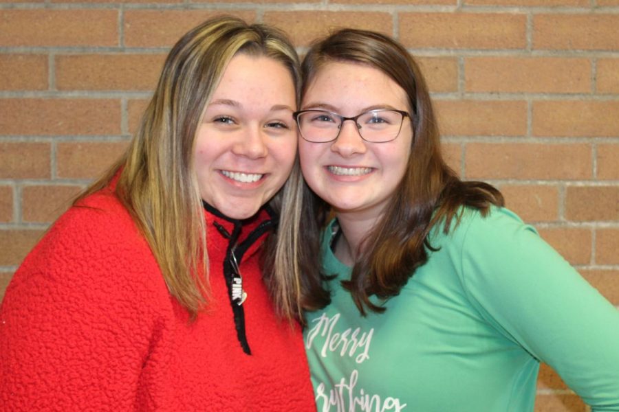 Freshmen's Kaylynn Bowden and Torri Griffith wear their red and green for red and green day Monday, Dec. 16,2019