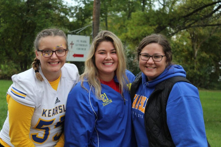 Junior Emma Cronkright smiles at the homecoming parade year of 2019 with her friends Isabelle Easton and Angel Truax