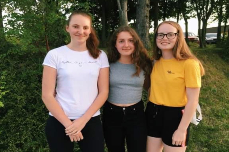 Julia Neuntefel (center) poses with her friends in Austria before coming to America. Neuntefel was a foreign exchange student during the first semester.