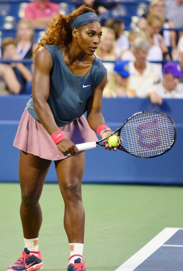 Serena Williams is preparing to serve.