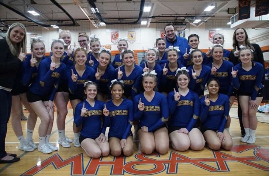 Competitive cheerleaders celebrate their victory at Flushing High School Wednesday, Jan 22. 