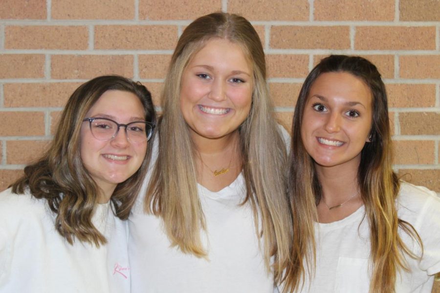 Juniors Allyson Sizemore(L to R), Cathlyn Healy, Madison Groulx wearing their white to show off their spirit to get points for the spirit cup.