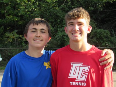 Freshmen Owen Clement and assistant coach Trenton Griffith pose for a picture after Clements match. 
