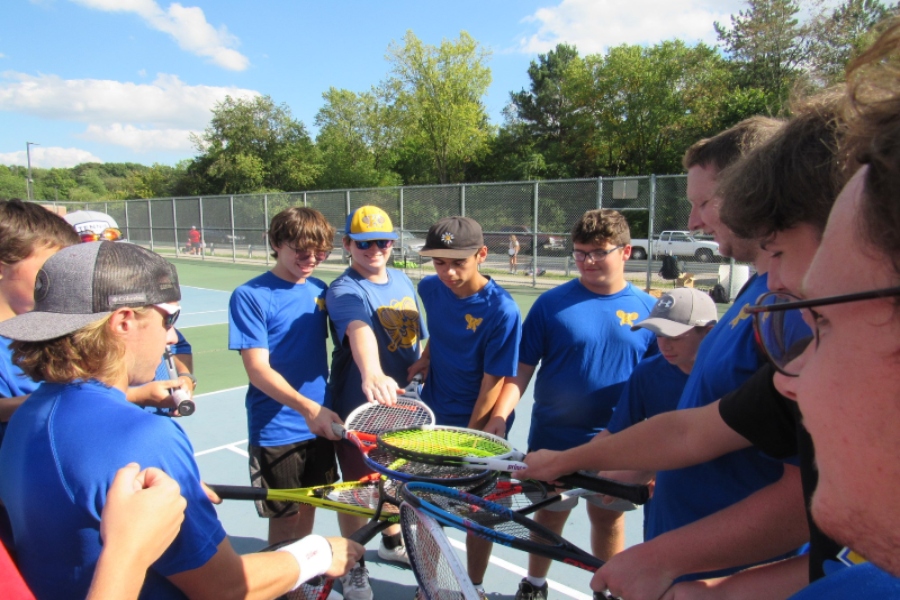 The+Kearsley+boys+tennis+team+huddling+up+before+starting+their+matches.+