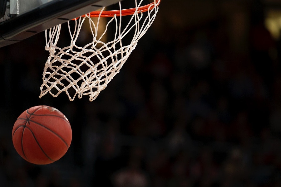 Basketball going through a hoop