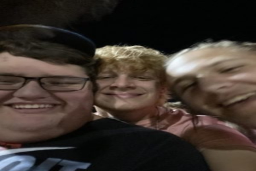 Me with my friends Dominic and Gage at a football game.