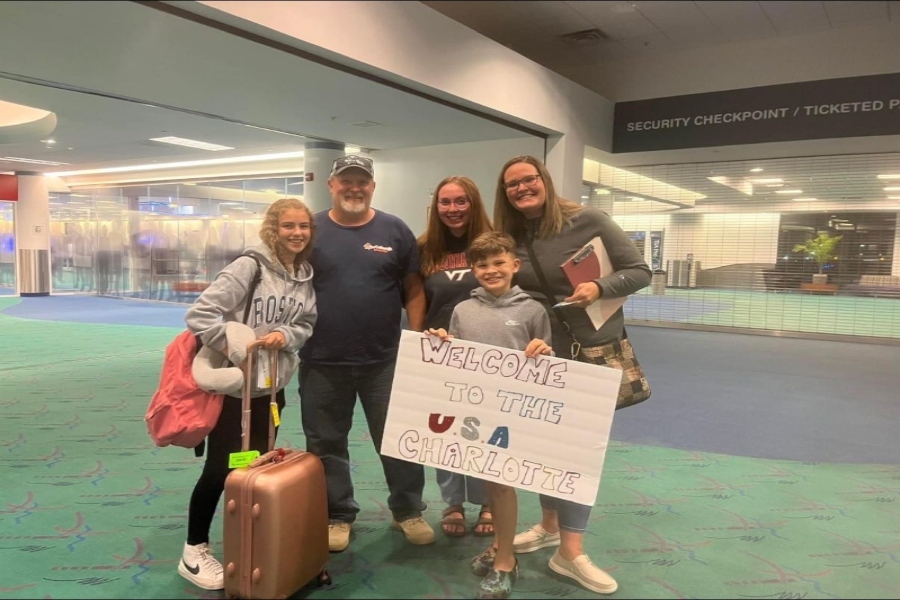 Charlotte Deloffre is welcomed to America by her hosts, the Oliver family.