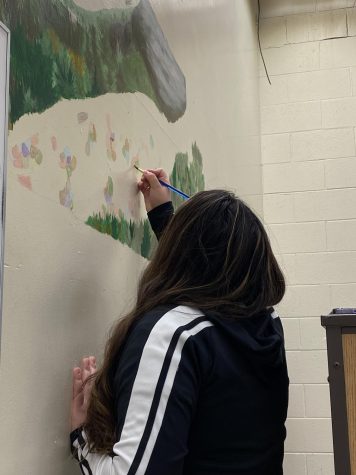 Thalia Sanson-Espinosa painting the newest mural for 2023.
