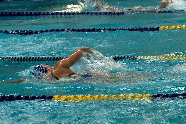 Senior, Elizabeth Soper competing in the 200 Freestyle event, where she finished in second place.